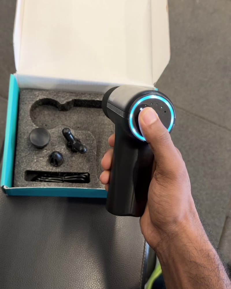 Salpido MG05 massage gun in its box with 4 heads